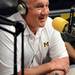 Michigan defensive coordinator Greg Mattison smiles as he recounts an experience with his granddaughter as Mott Children's Hospital as he speaks on the air at WTKA 1050 during a fundraiser for Mott Children's Hospital at the station on Friday. Melanie Maxwell I AnnArbor.com